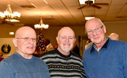 May be an image of 3 people, people standing and indoor
